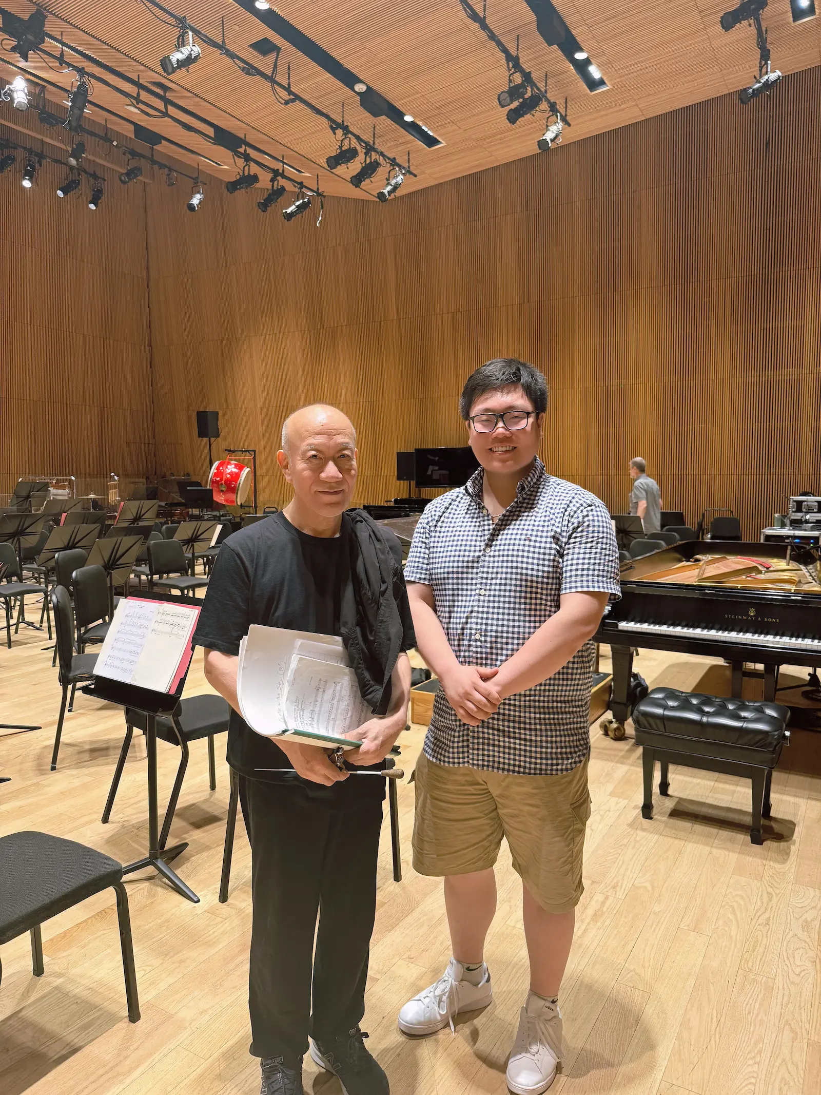 Jacky Y. Xu working as percussion technician for a Joe Hisaishi concert